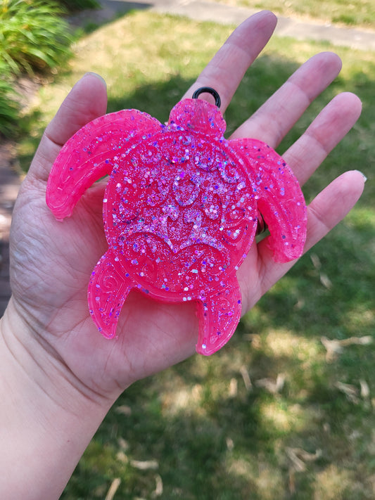 Pink sea turtle with glitter.